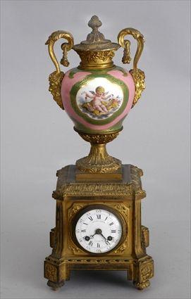 Appraisal: LOUIS XVI SEVRES PORCELAIN-MOUNTED GILT-BRONZE CLOCK The in enamel dial