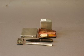 Appraisal: Two silver cigarette cases together with a cigar holder in