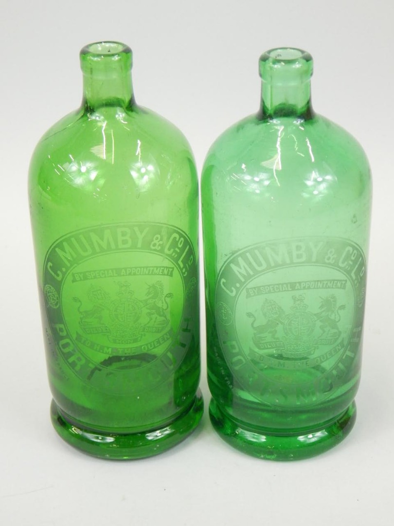 Appraisal: Two green glass bottles with etched decoration for C Mumby