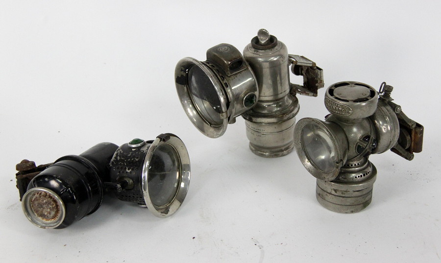 Appraisal: Three carbide cycle lamps various