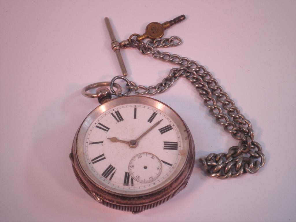 Appraisal: A silver pocket watch in engine turned case Chester and