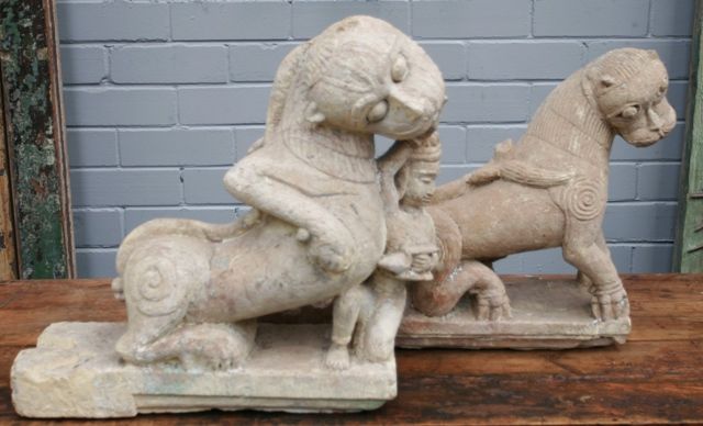 Appraisal: An important pair of sandstone lions architectural details temple figures