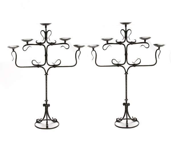 Appraisal: A pair of wrought metal five light candelabra height in