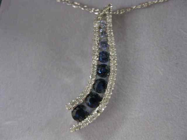 Appraisal: Sapphire Diamond Pendant round gems from light to deep blue