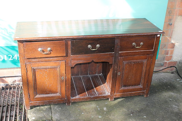 Appraisal: A VICTORIAN STAINED PINE DRESSER BASE fitted three drawers and