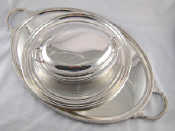 Appraisal: Silver plate An oval two handled tray with gadrooned edge