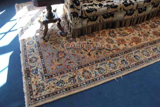 Appraisal: A Kashan style carpet with field of scrolling foliage on