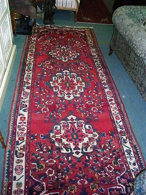 Appraisal: A PAIR OF HAMADAN RUGS with three central white ground