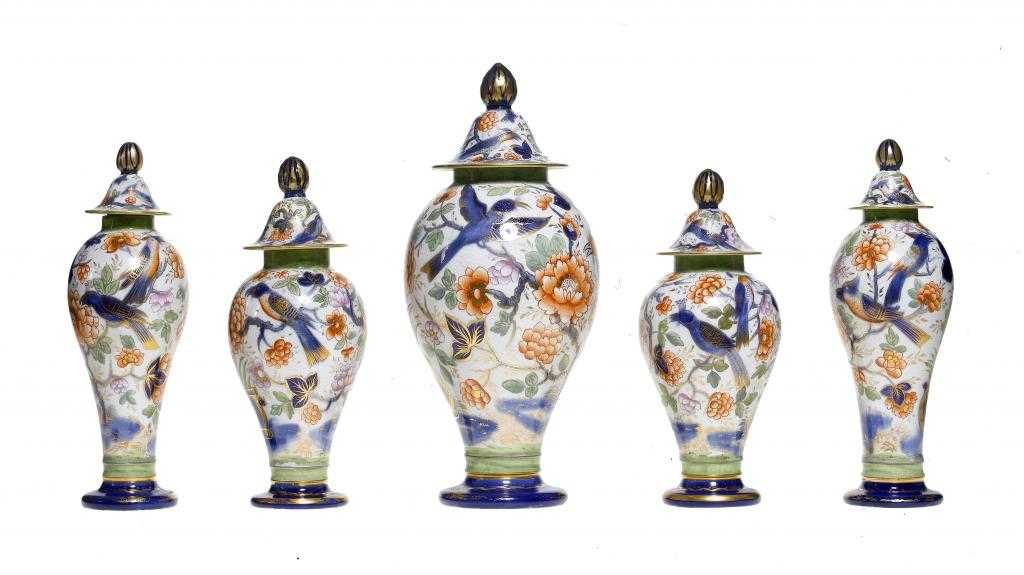 Appraisal: A RARE BRAMELD PEARLWARE GARNITURE OF FIVE VASES AND COVERS