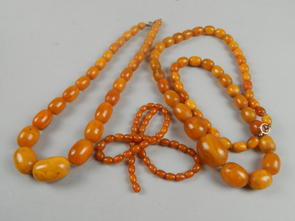 Appraisal: Two butterscotch amber beaded necklaces and a smaller necklace g