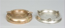 Appraisal: Two Art Deco Ashtrays First is a silver ashtray with