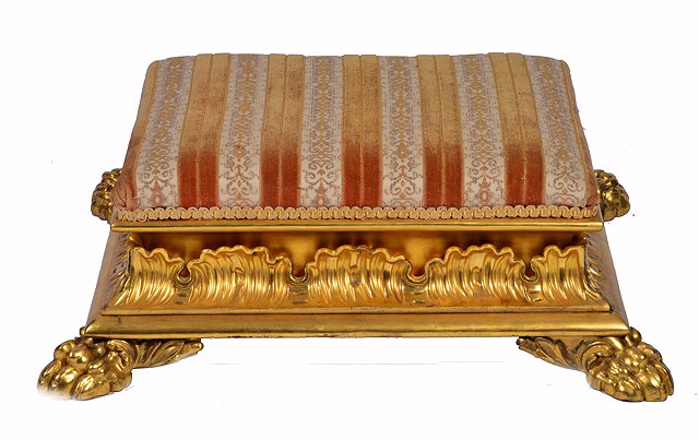 Appraisal: A GEORGE IV RECTANGULAR GILTWOOD FOOT STOOL with upholstered top