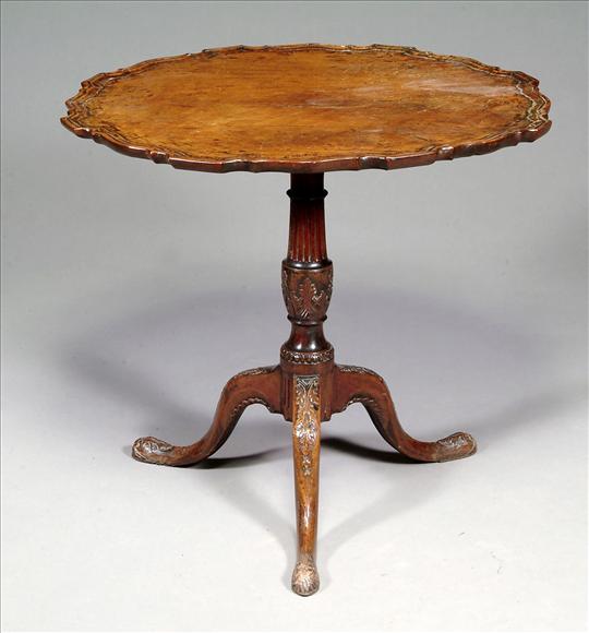 Appraisal: A George III mahogany piecrust tripod table circa the wavy