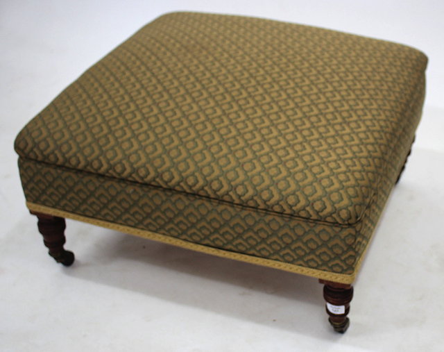 Appraisal: A SQUARE OVERSTUFFED UPHOLSTERED STOOL with turned legs and ceramic