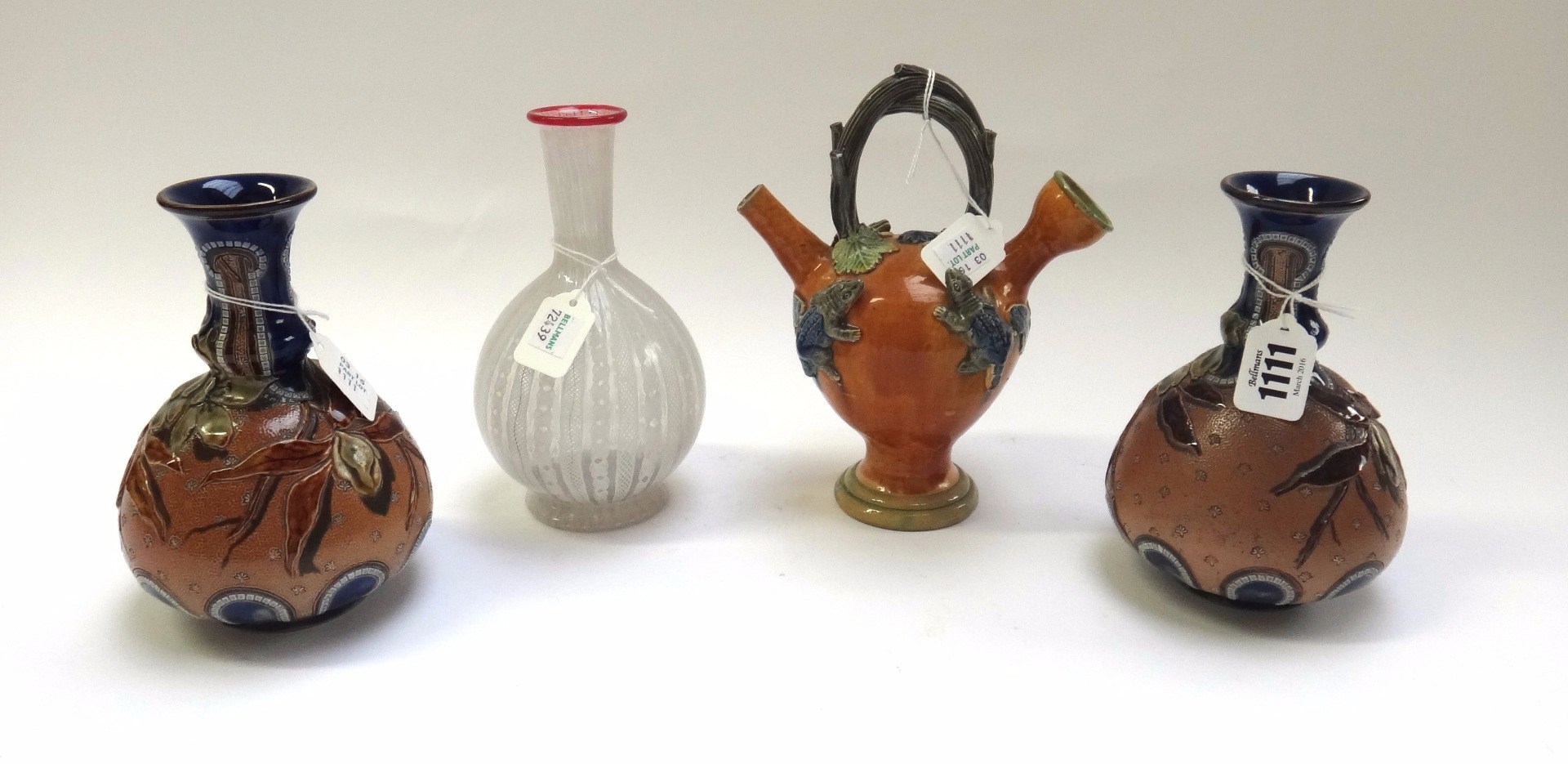 Appraisal: A pair of Doulton Lambeth stoneware bottle neck vases by