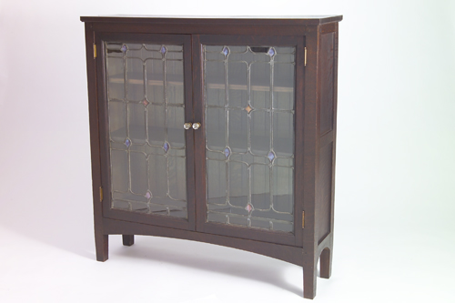 Appraisal: ARTS CRAFTS Exceptionally well made two-door bookcase with leaded glass