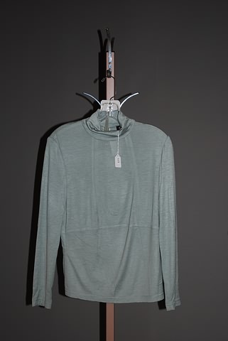 Appraisal: CHADO Olive green knit top with jewel neck and back