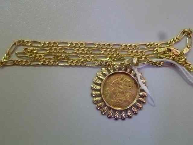 Appraisal: A HALF SOVEREIGN in ct gold mount and stylised chain