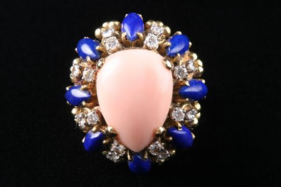 Appraisal: K YELLOW GOLD ANGELSKIN CORAL LAPIS AND DIAMOND RING Centered