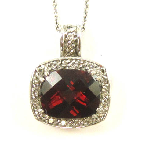 Appraisal: GARNET AND DIAMOND PENDANT NECKLACE suspended on an inch k