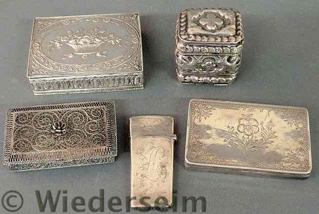 Appraisal: Four small silver boxes and a silver cased nail pick