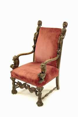 Appraisal: An American carved beechwood 'Evolution' chair the padded back flanked