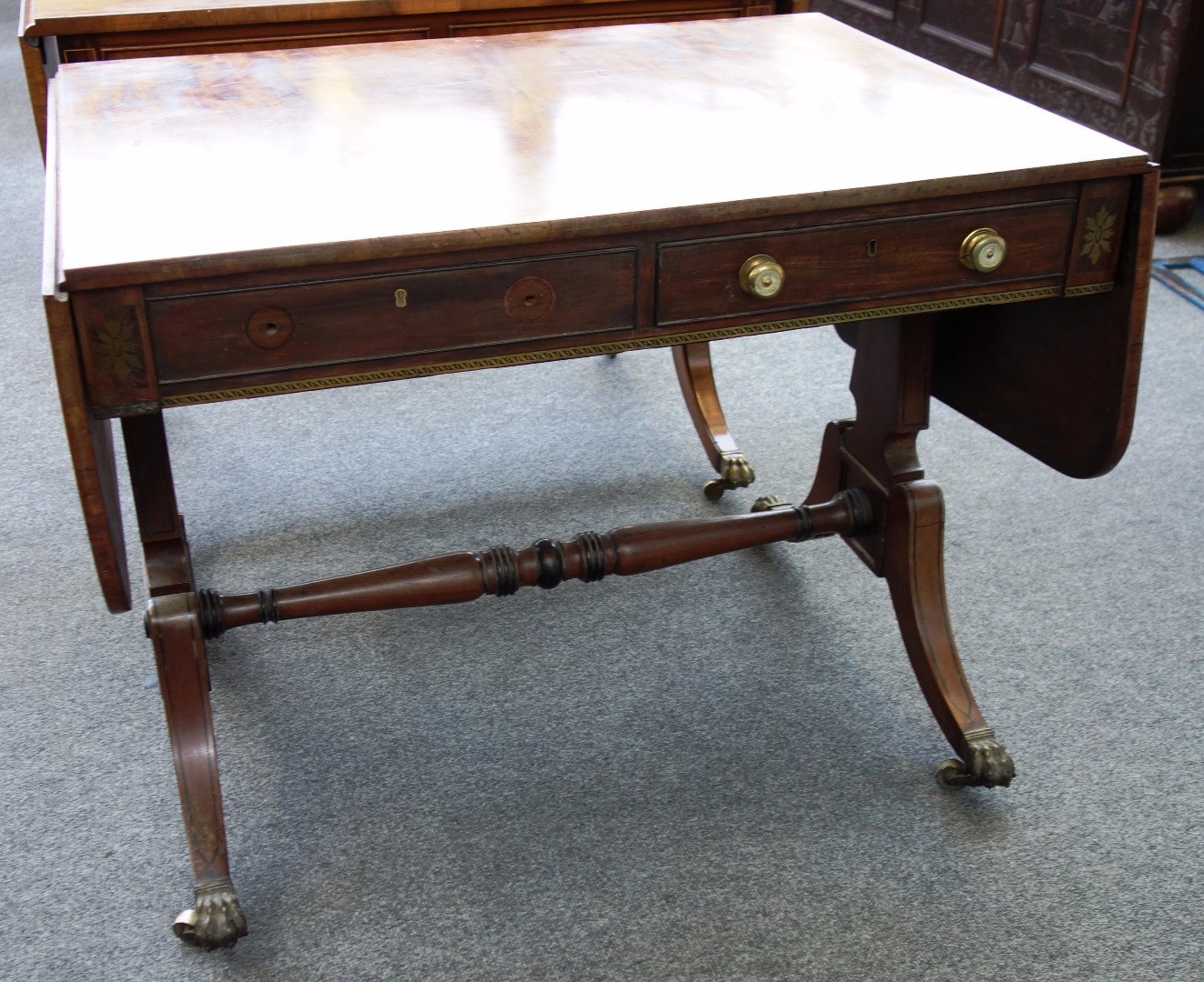 Appraisal: A Regency mahogany sofa table with opposing frieze drawers on