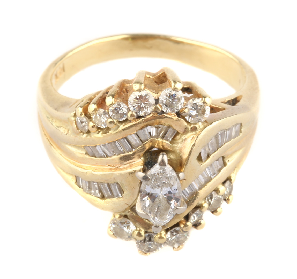 Appraisal: A Marquise Diamond Ring K gold marquise center diamond with