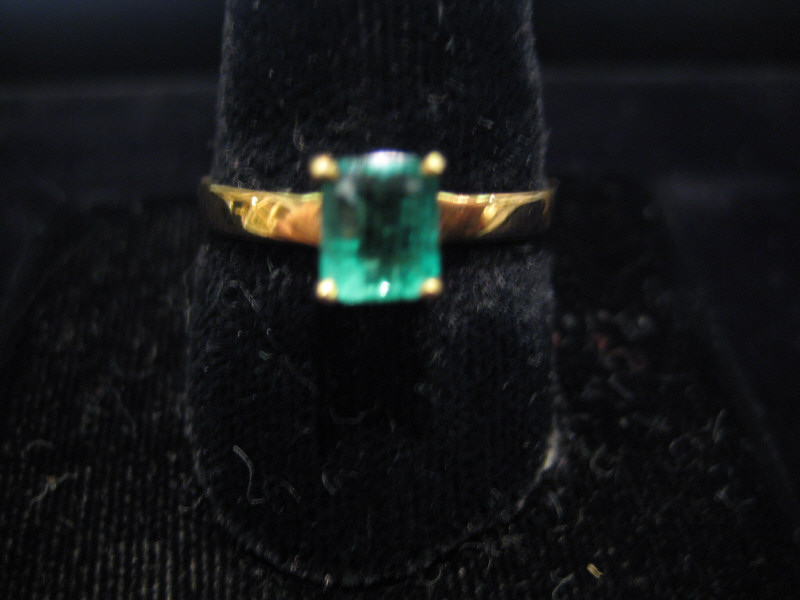 Appraisal: EMERALD RING k yellow gold solitaire ring set with one