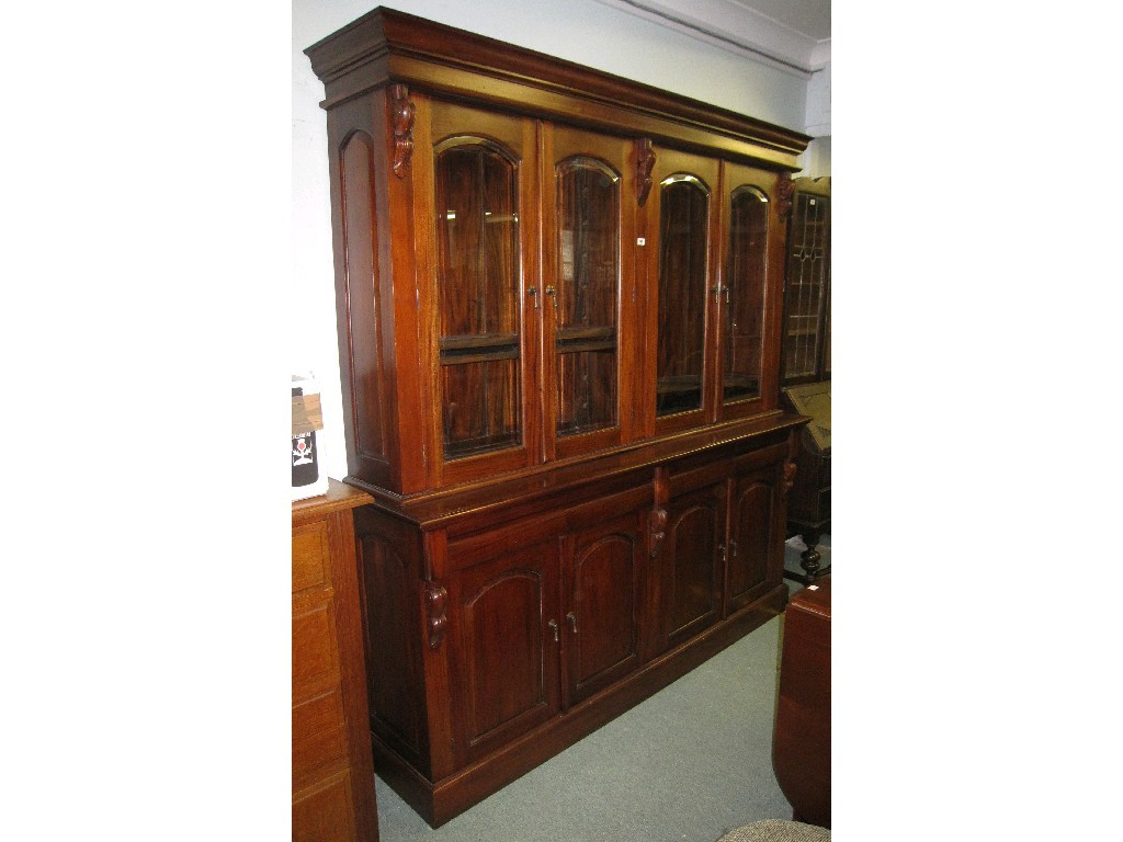 Appraisal: Reproduction mahogany four door bookcase on cabinet