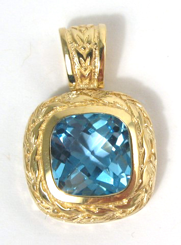 Appraisal: BLUE TOPAZ AND FOURTEEN KARAT GOLD PENDANT set with a