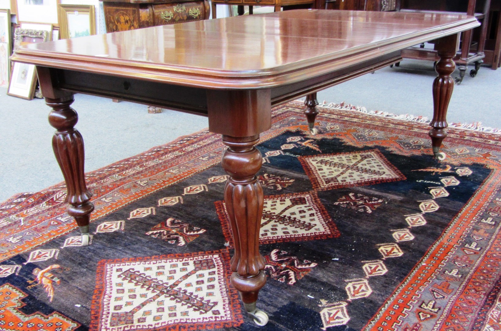 Appraisal: A William IV mahogany extending dining table on reeded baluster