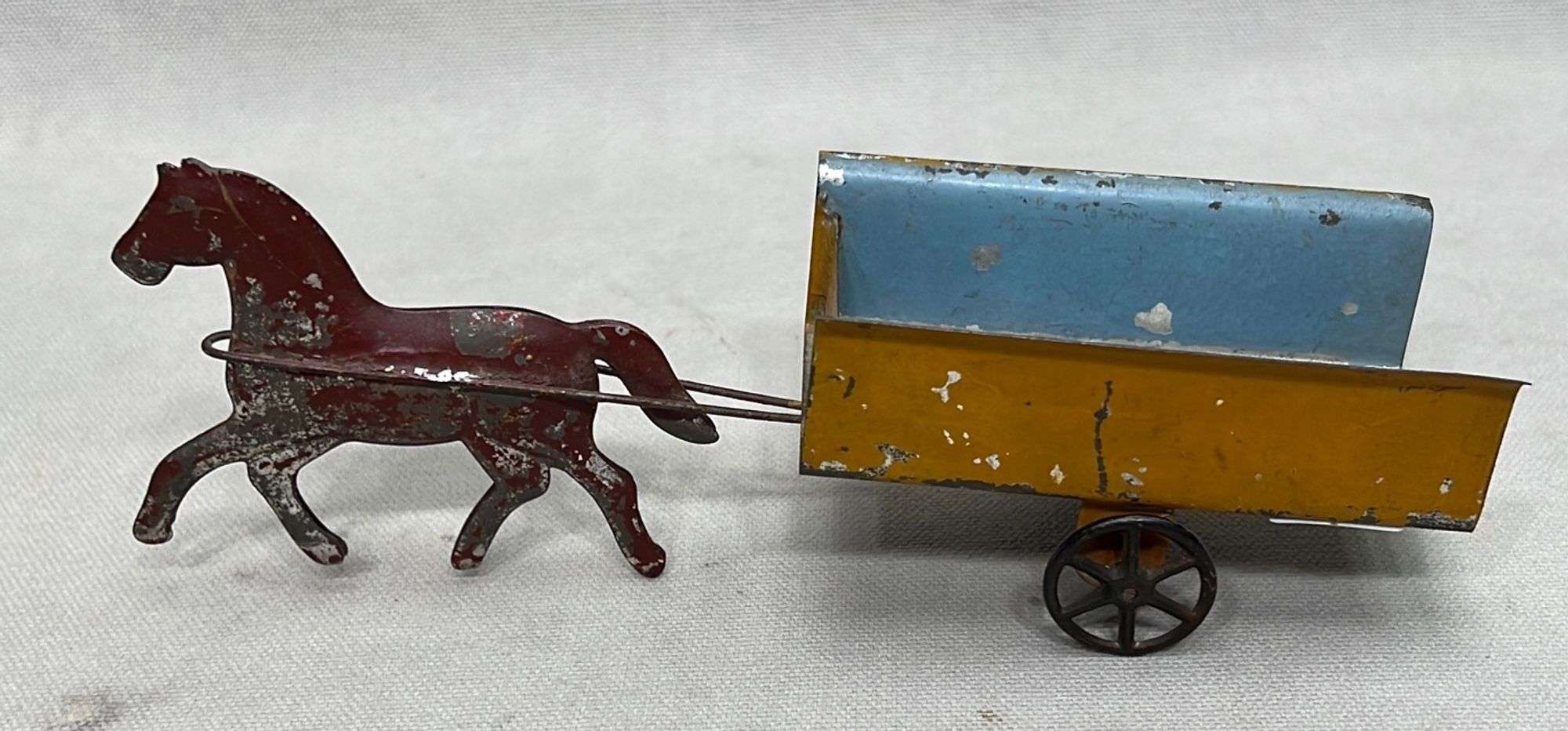 Appraisal: American pressed tin horse and cart toylate th to early