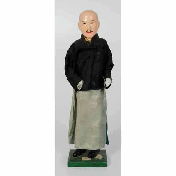 Appraisal: Chinese Composition Character Dolls China a composition and plaster doll