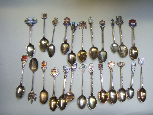 Appraisal: Twenty four mostly enamelled souvenir town crest spoons both British