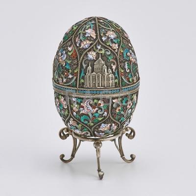 Appraisal: RUSSIAN ENAMELED SILVER EGG-SHAPED BOX Vertically lobed and wirework banded