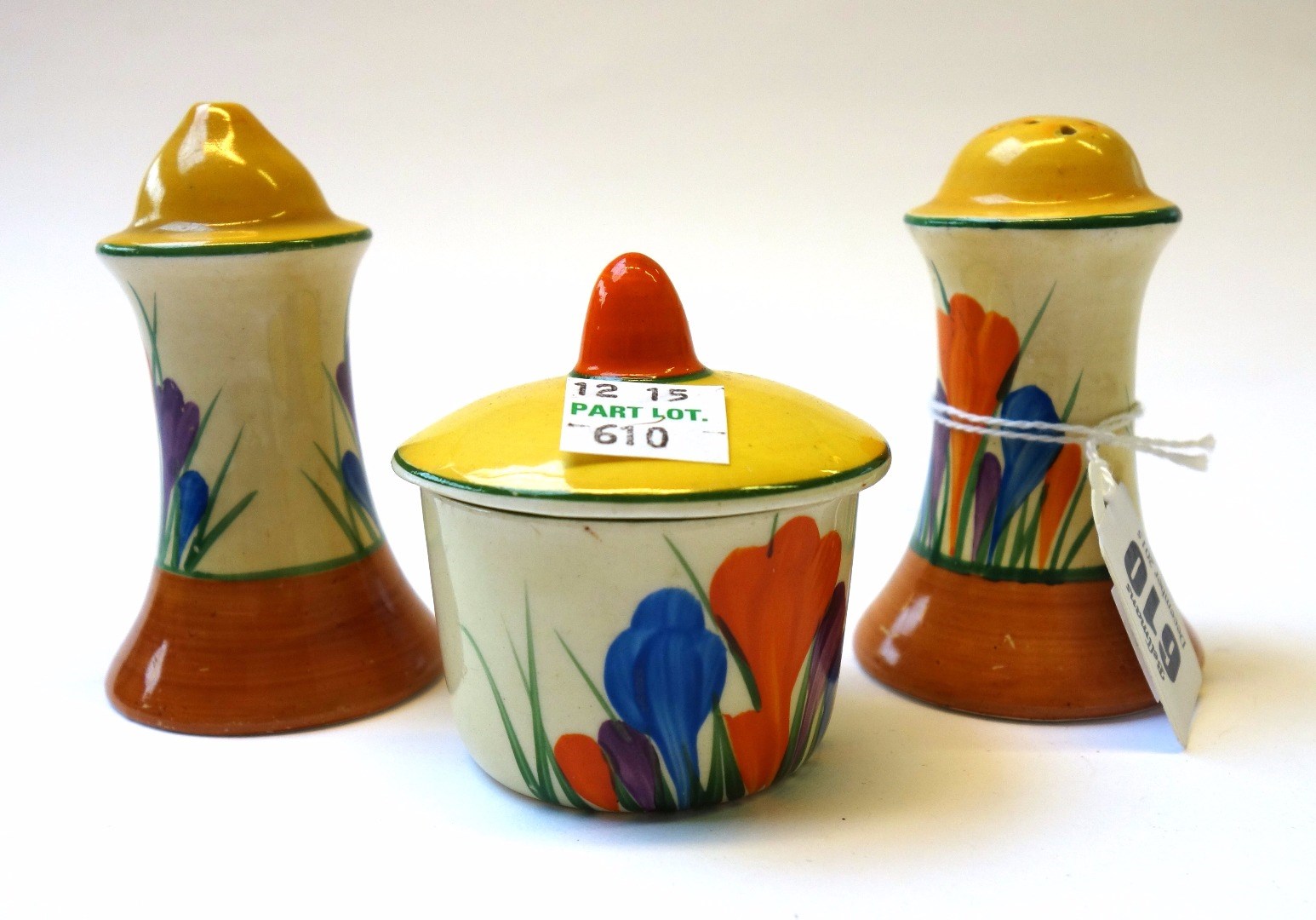 Appraisal: A Clarice Cliff three piece condiment set circa decorated in