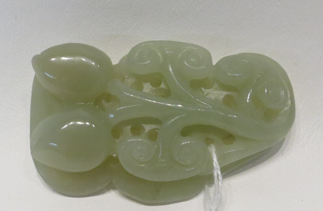 Appraisal: CARVED JADEITE HAND PIECE depicting a floral and vine motif