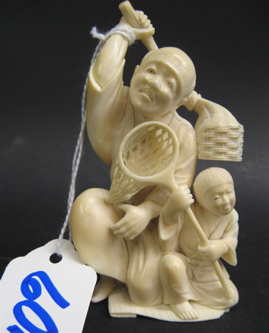 Appraisal: JAPANESE IVORY CARVED FIGURE of a man carrying basket with