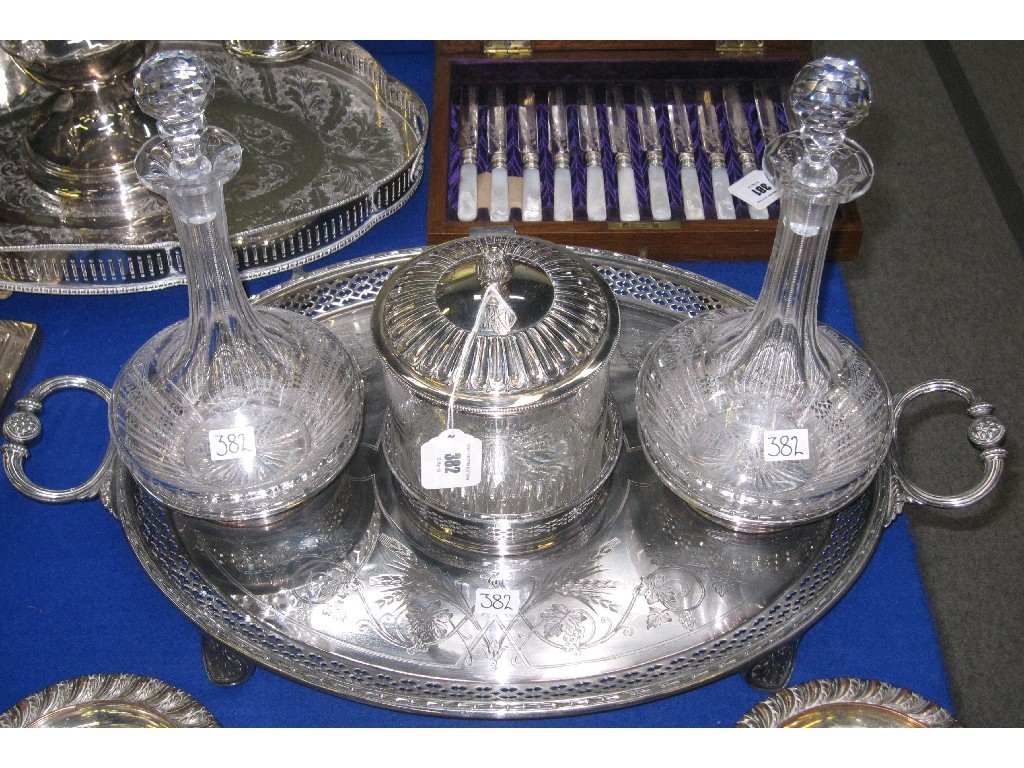 Appraisal: Silver plate and etched glass decanter biscuit barrel tray