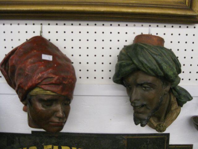 Appraisal: Pair of Figural Terra Cotta Players Morrocan man woman Victorian