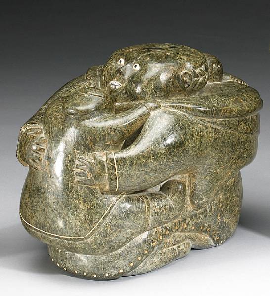 Appraisal: Eskimo and Northwest Depicting a maternity group the mother holding