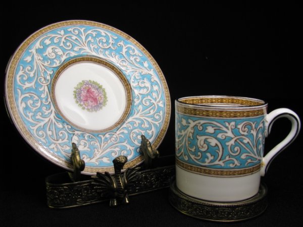 Appraisal: Wedgwood Praze W demitasse cup and saucer with ornate brass