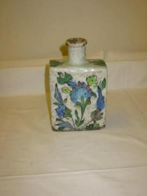 Appraisal: A PERSIAN STONEWARE BOTTLE FLASK of rectangular form outlined in