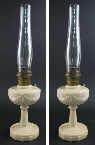 Appraisal: PAIR OF AMERICAN ALADDIN DUSKY ROSE GLASS OIL LAMPS in