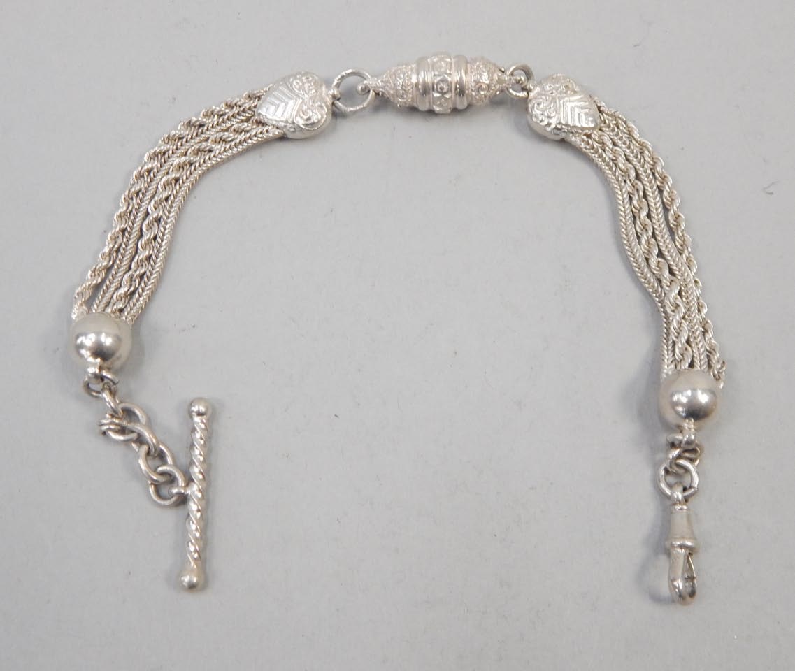 Appraisal: An elaborate silver plated watch chain with floral and heart