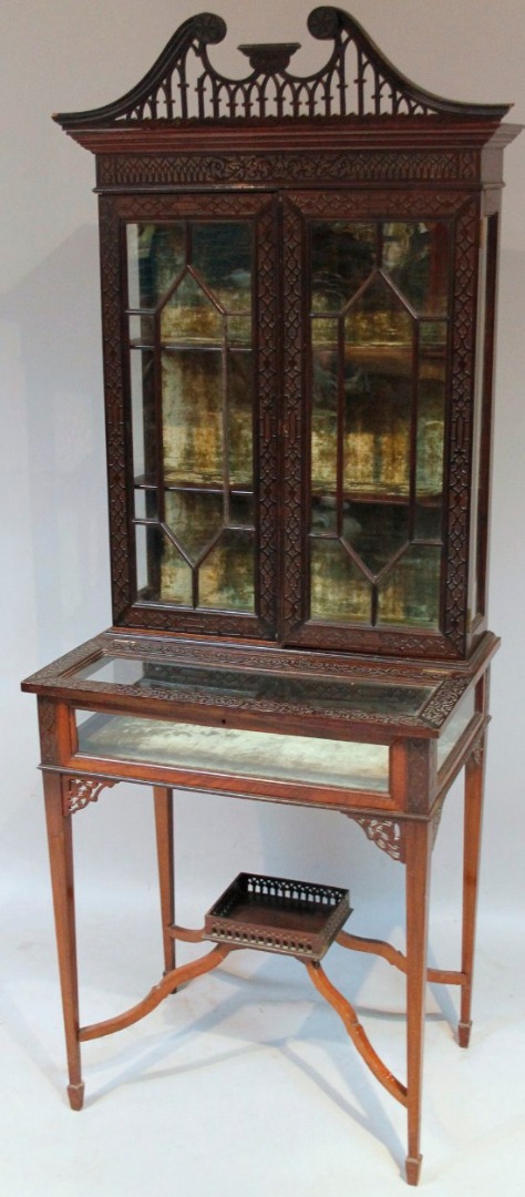 Appraisal: A thC mahogany stained bijouterie display cabinet with an overall