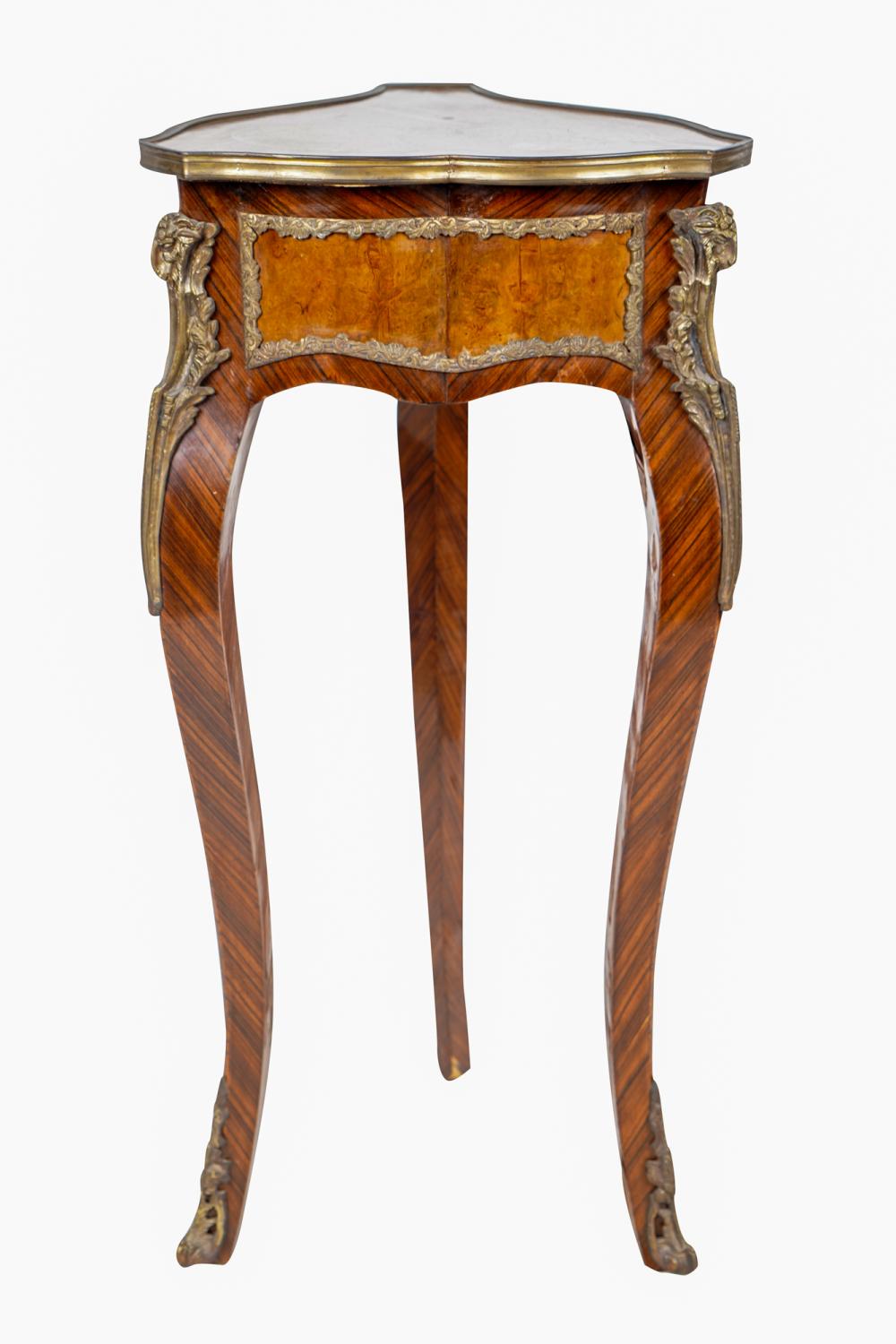 Appraisal: LOUIS XV- STYLE GILT-BRONZE-MOUNTED GUERIDONwith inlaid triangular top over inches