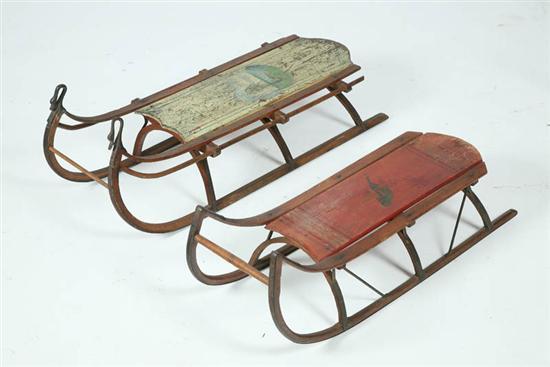 Appraisal: TWO SLEDS Both paint decorated and one with iron swan