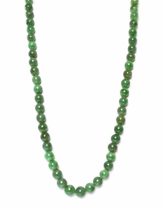 Appraisal: A Single Strand Graduated Jade Bead Necklace containing numerous beads